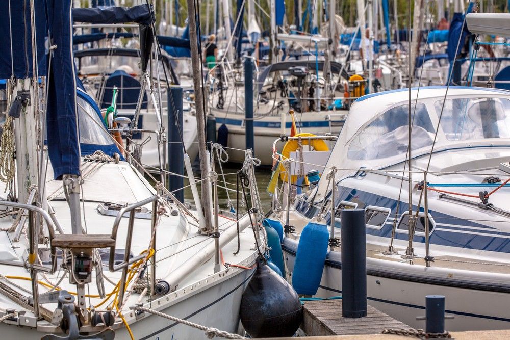 Close-up of two boats docked in a marina.