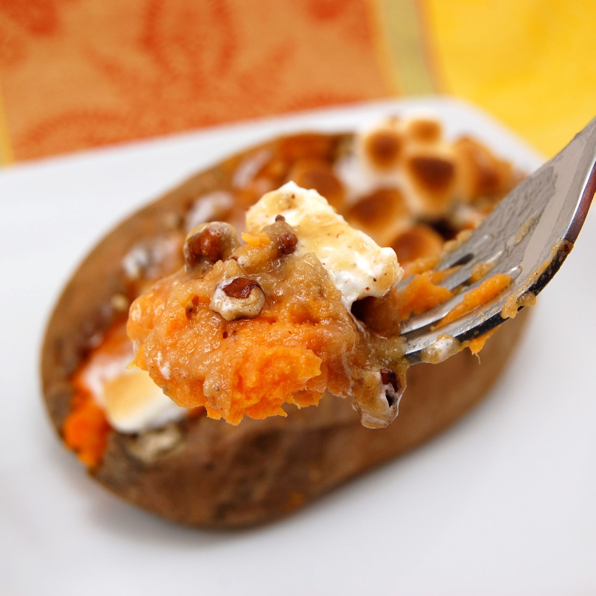 Baked sweet potatoes with marshmallow pecan topping