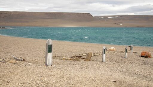 Headstones of Franklin Expedition members next to the ocean on Beechy Island, Nunavut.