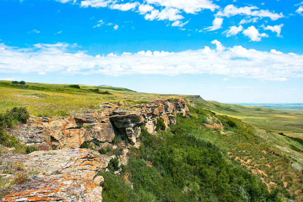 Rocky, grass-covered ridge of Head-Smashed-In Buffalo Jump, Alberta.