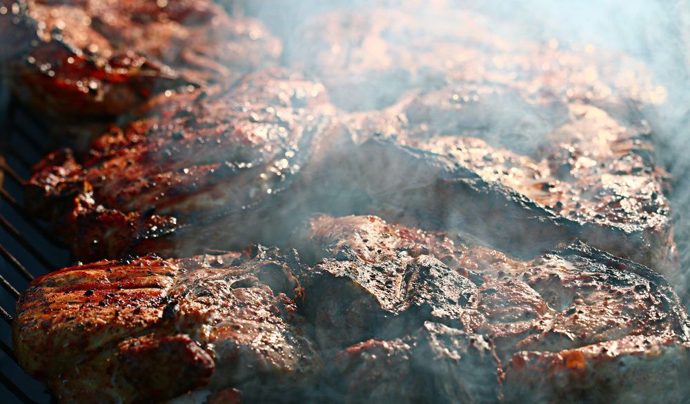 Close-up of smoked meat on a grill.