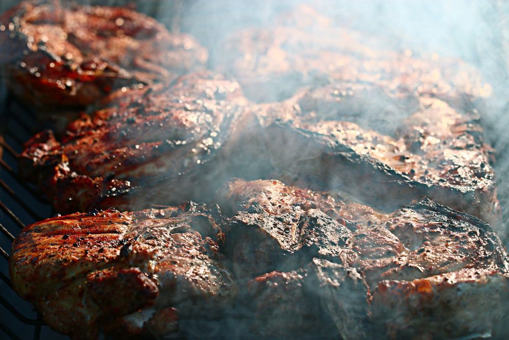 Close-up of smoked meat on a grill.