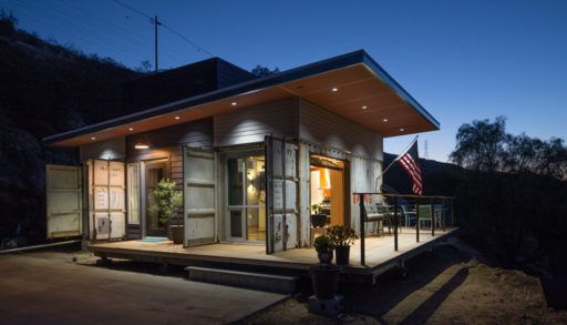 An exterior night time view of the cabin.