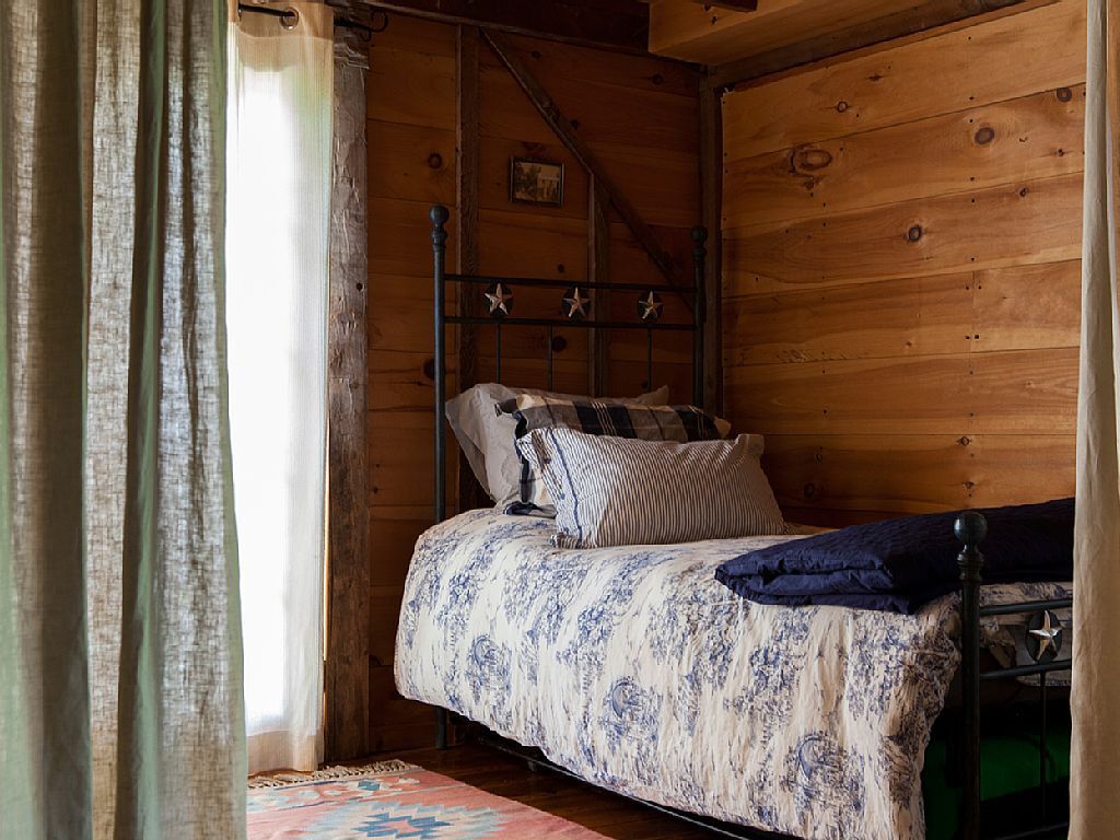 The single trundle bed in the restored barn.