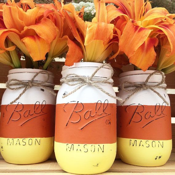 Jars painted like candy corn.