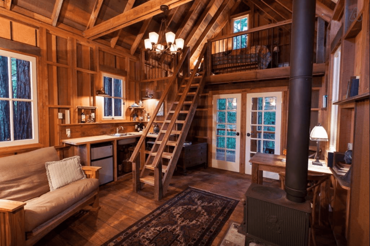 A view of Owl Tree cabin's living room and kitchen.