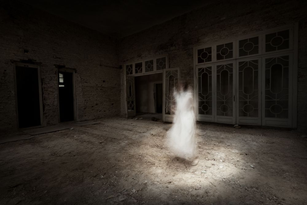 Ghost girl in a white dress in an old room.