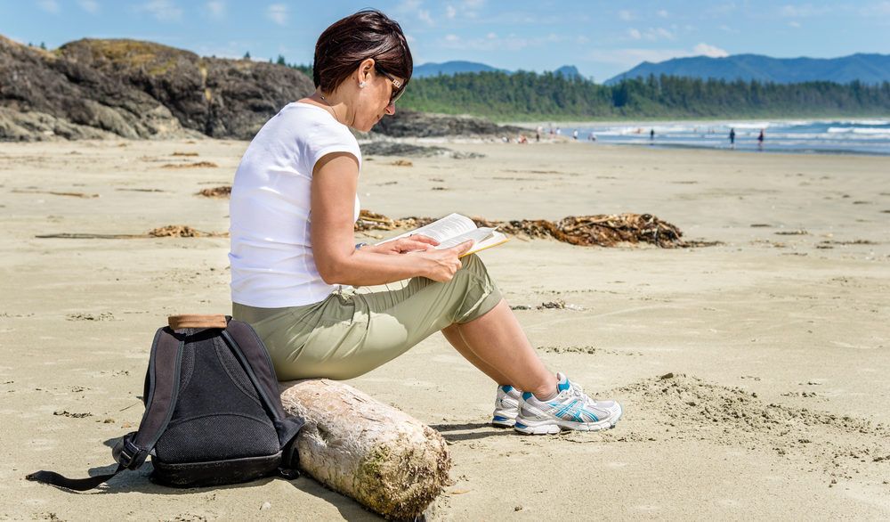 Woman reading on the beach.
