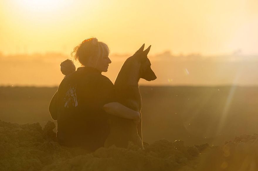 Photographer Tanja Brandt poses with dog and miniature owl