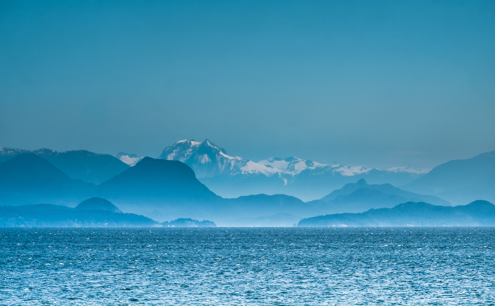 View of the Coast Mountains in B.C. across the Georgia Strait from Vancouver Island.