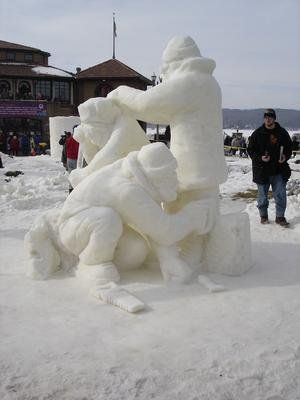 Realistic snowmen building one another