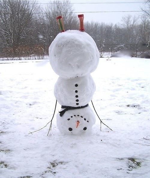 Snowman standing on its head