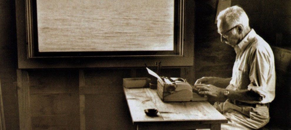 E.B. White writing at a cabin