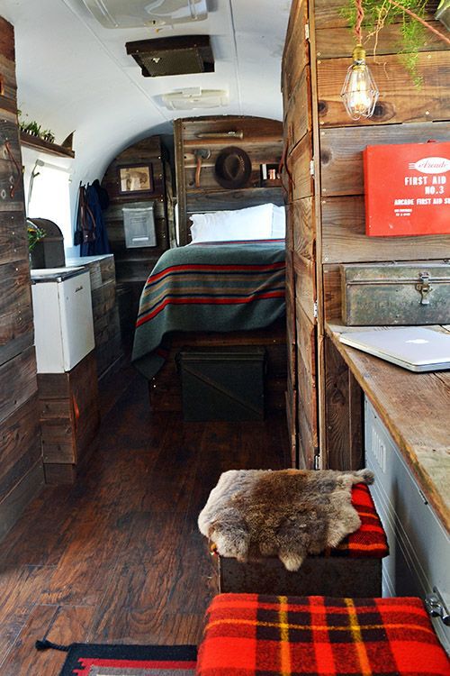 Interior of trailer with rustic wood and bed