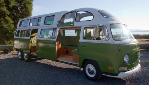 A long, green VW Van