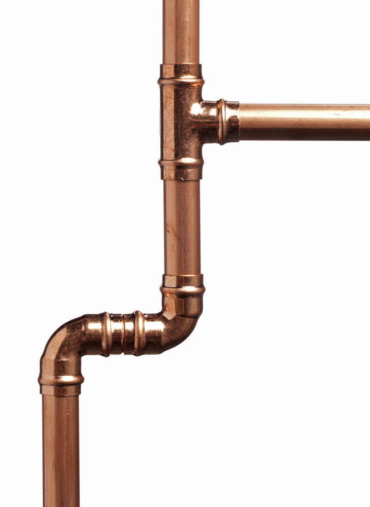 Orange copper pipe against a white background.