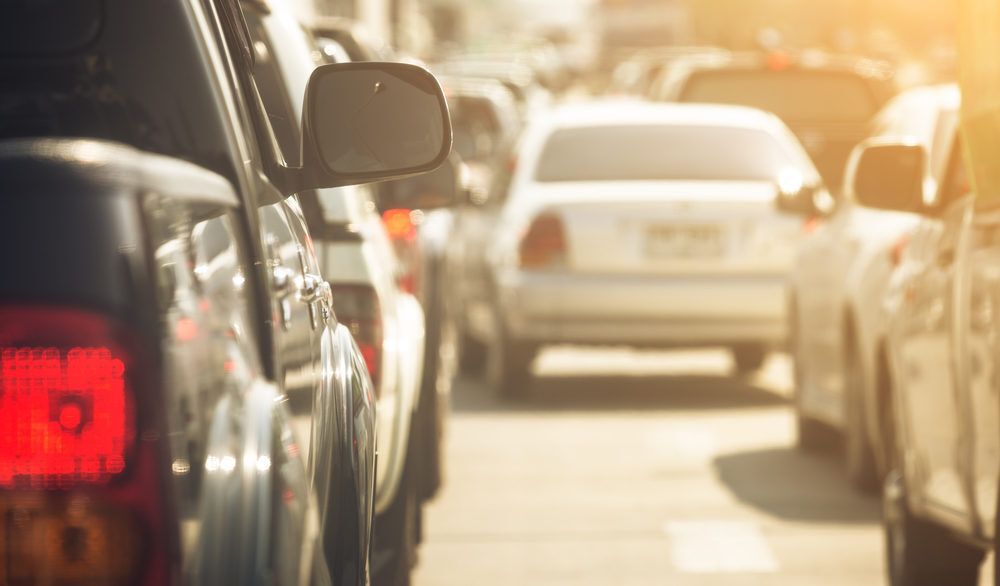 Close-up of cars lined up in traffic.