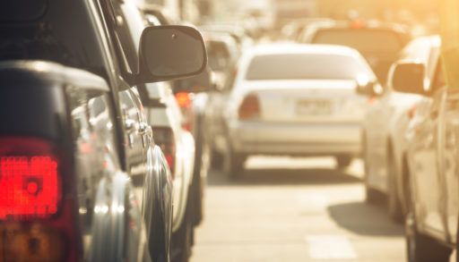 Close-up of cars lined up in traffic.