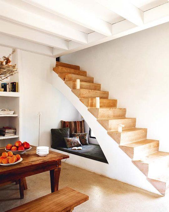 A reading nook under stairs