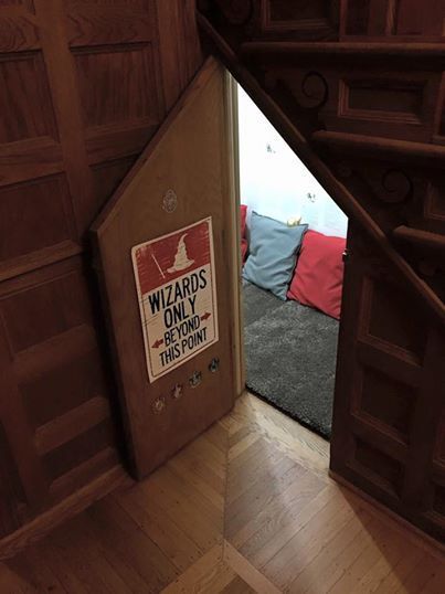 Tiny door with "wizards only" sign