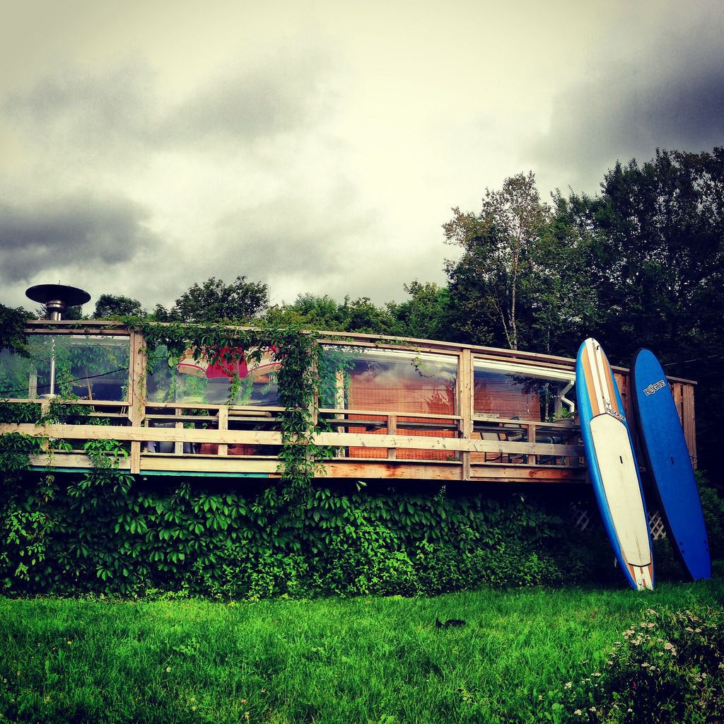 surfboards leaning against patio