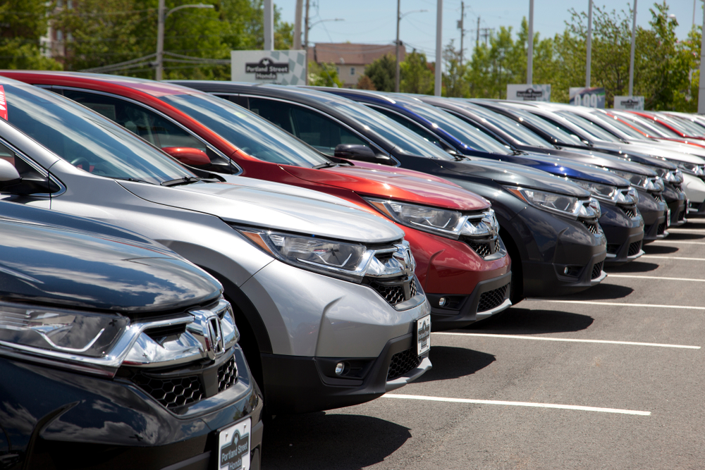 SUVs lined up in a car lot.