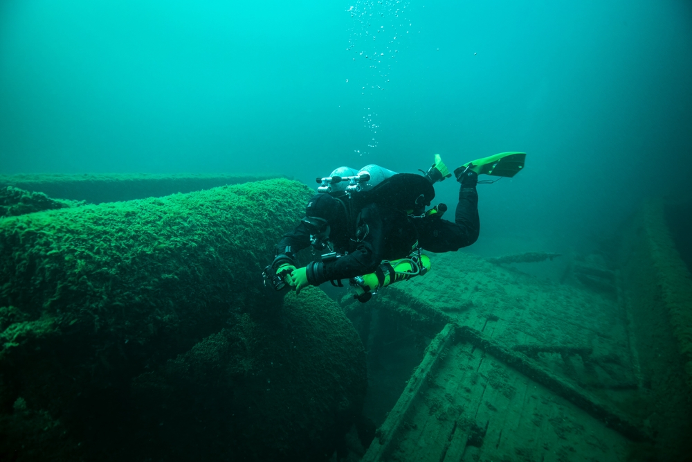 Diver exploring a shipwreck.