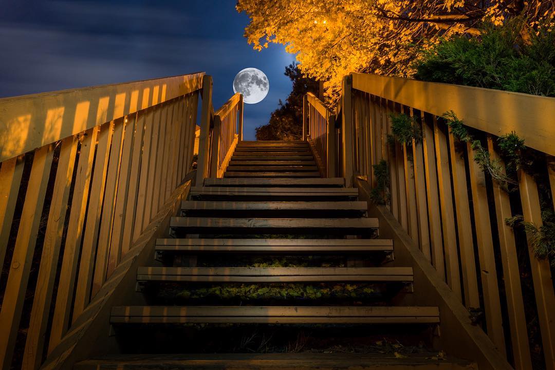 Moon seen at top of stairs