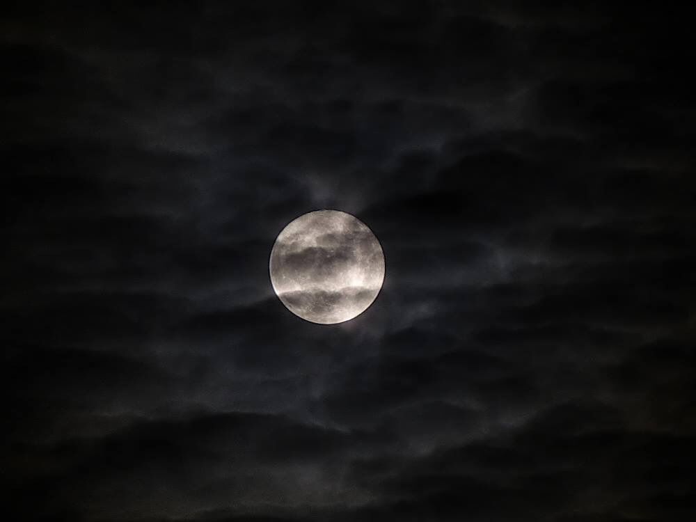 moon behind misty clouds