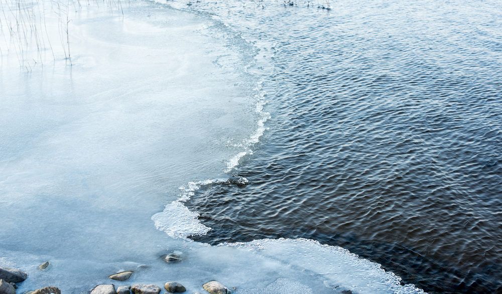Partly frozen lake in the winter time.