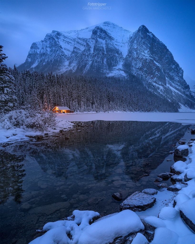 Lake Louise and a small lit-up cabin