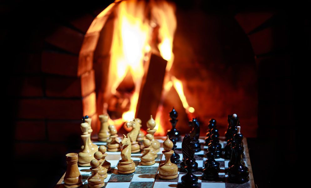 chess board in front of fire