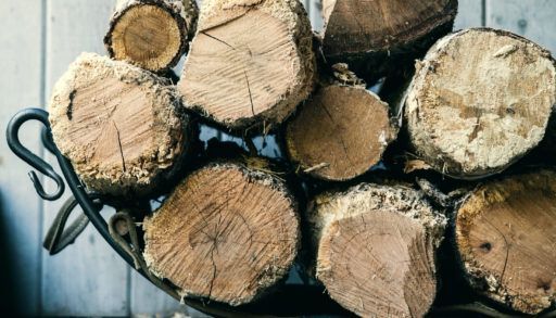 Pile of firewood stacked up indoors.