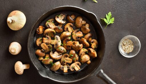 Roasted mushrooms in a cast iron pan.
