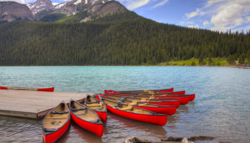 Red canoes on Lake Louise, Banff National Park, Alberta, Canada.