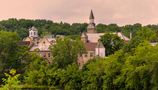 View on an old building surrounded by a forest landscape at sunset in Paris, Ontario, Canada.