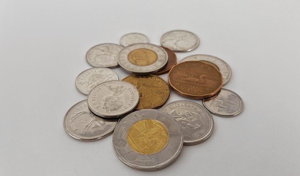 Canadian coins in a pile.