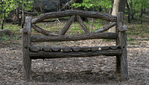 Unique wooden bench in a park.
