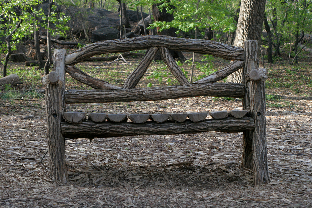Unique wooden bench in a park.