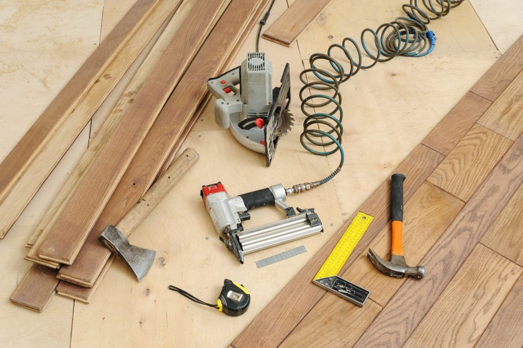 Essential power tools being used to install flooring.