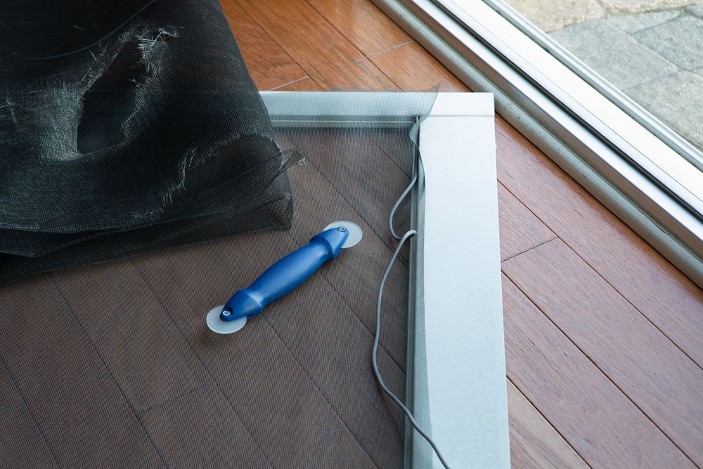 Replacing a ripped screen door.