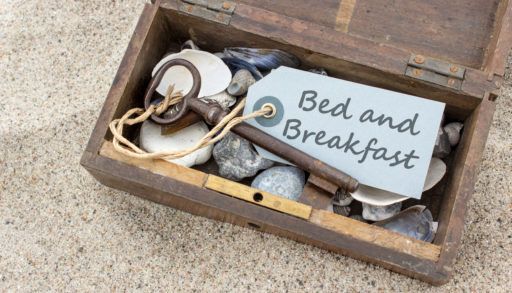 A box with a key that says bed and breakfast