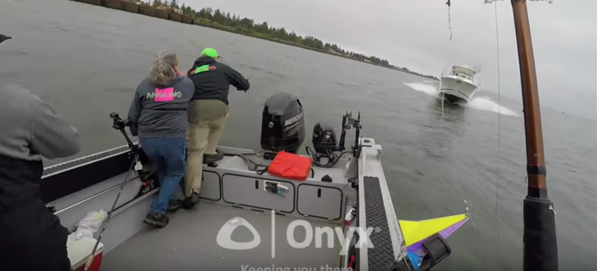 Three people preparing to jump off boat as another boat approaches