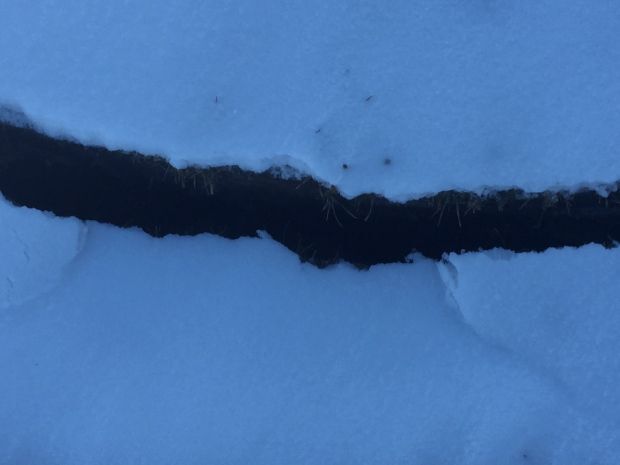 crack in snowy ground