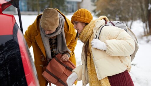 couple packing the car in winter