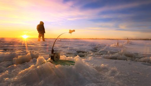 ice-fishing-on-a-river-at-sunset