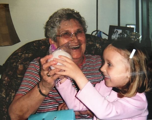 Child's hand holding a snowball