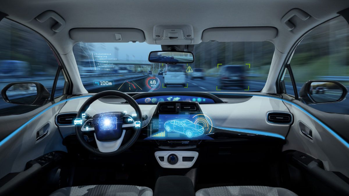 High tech self-driving-car with blue LED displays on the dashboard.