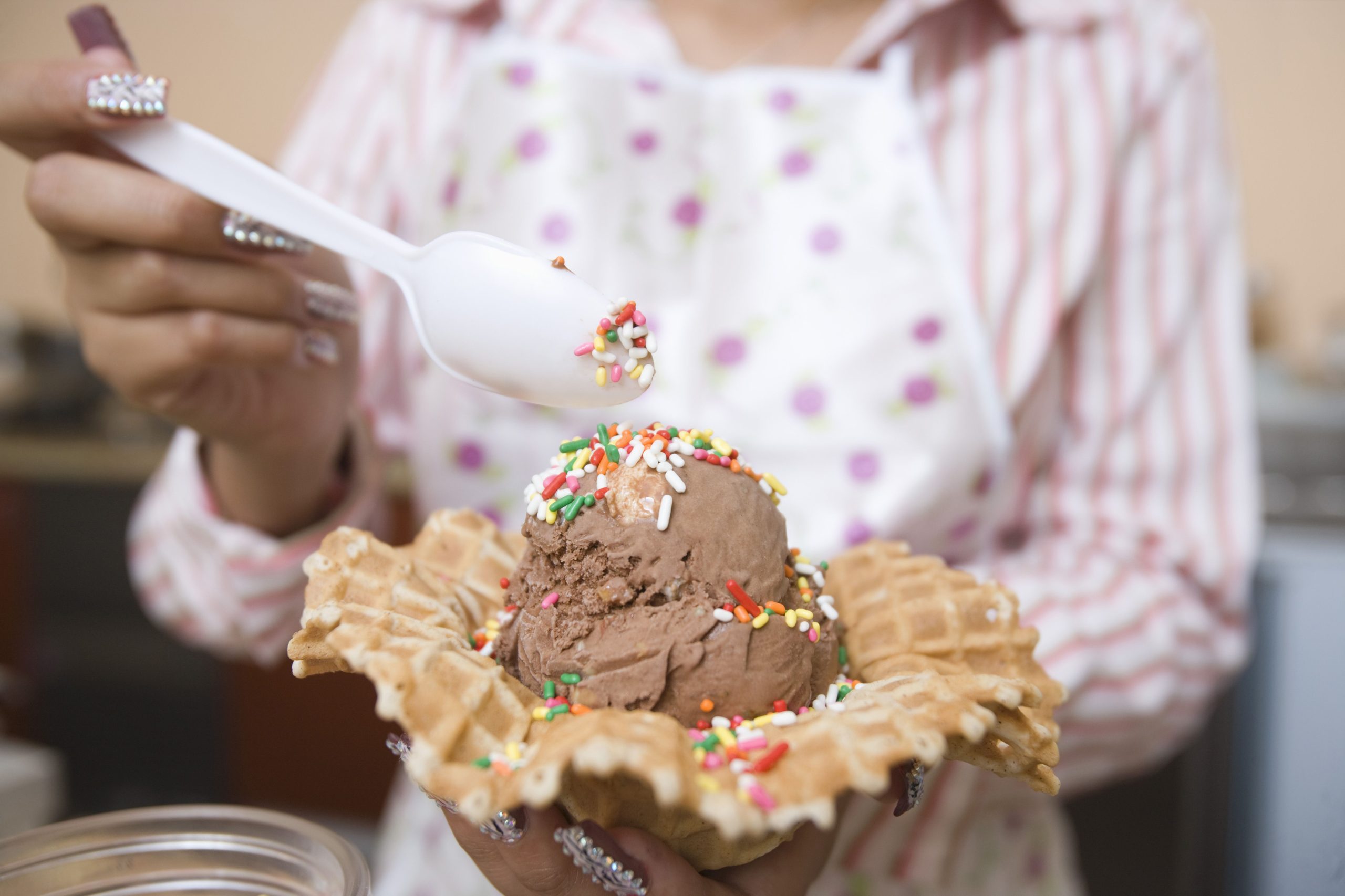 close-up-of-chocolate-ice-cream-with-sprinkles-being-served
