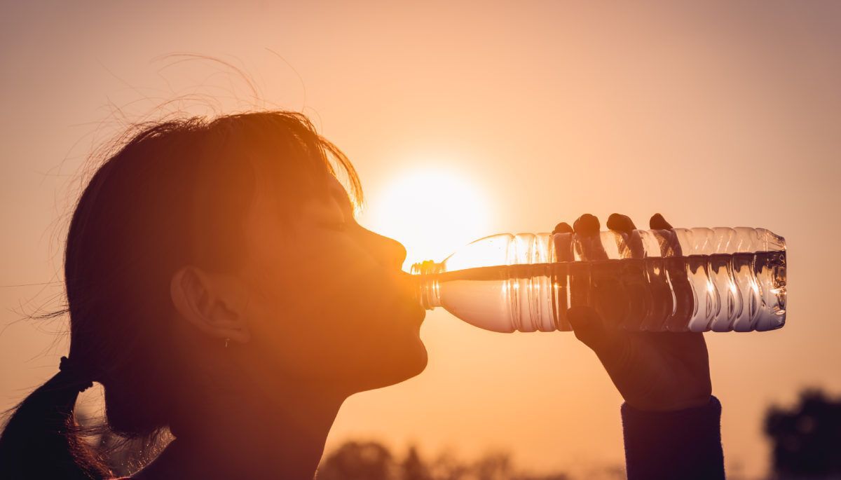 woman-in-hot-weather-drinking-water-bottle